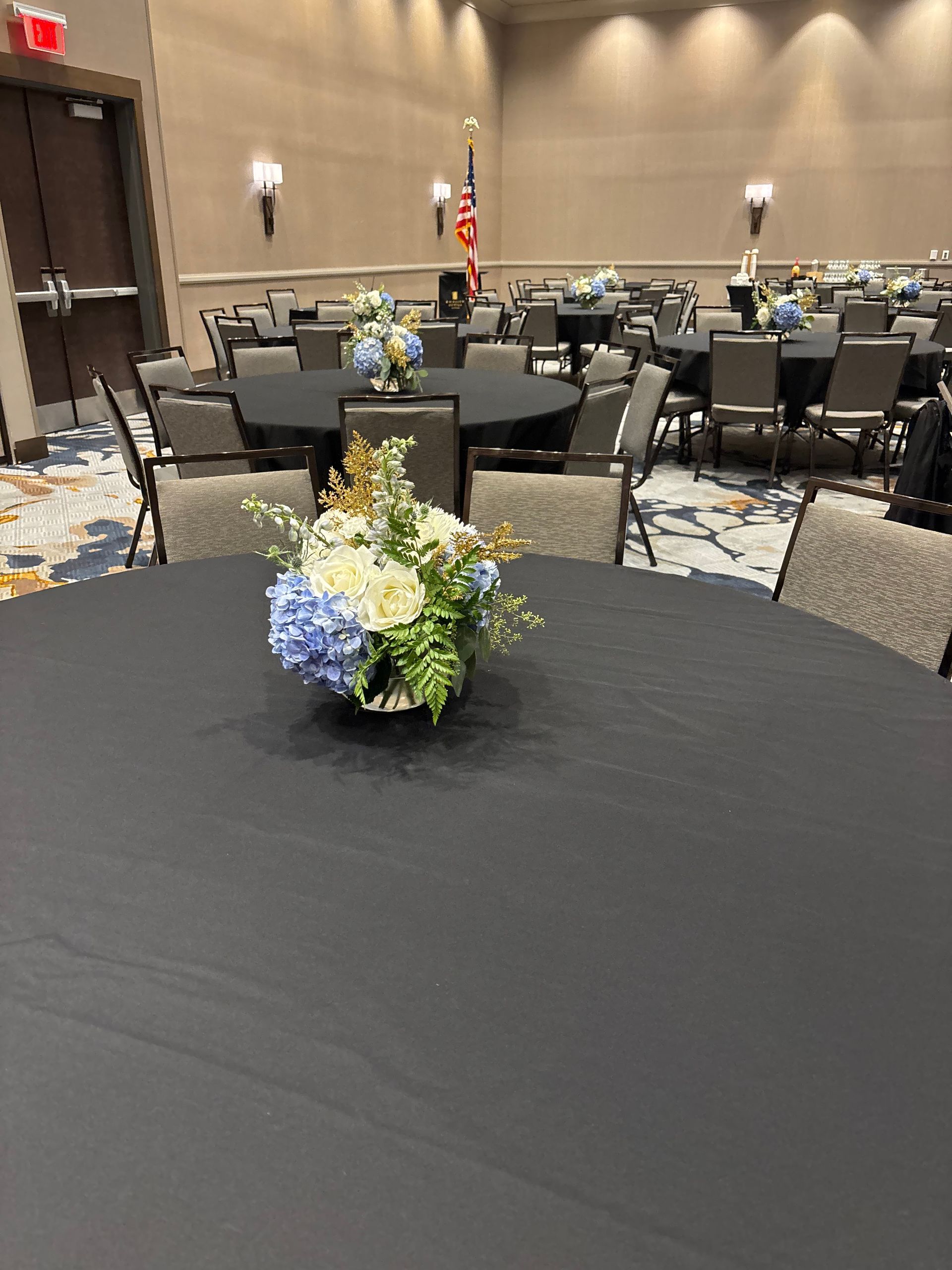 simple blue and white floral centerpieces for corporate event