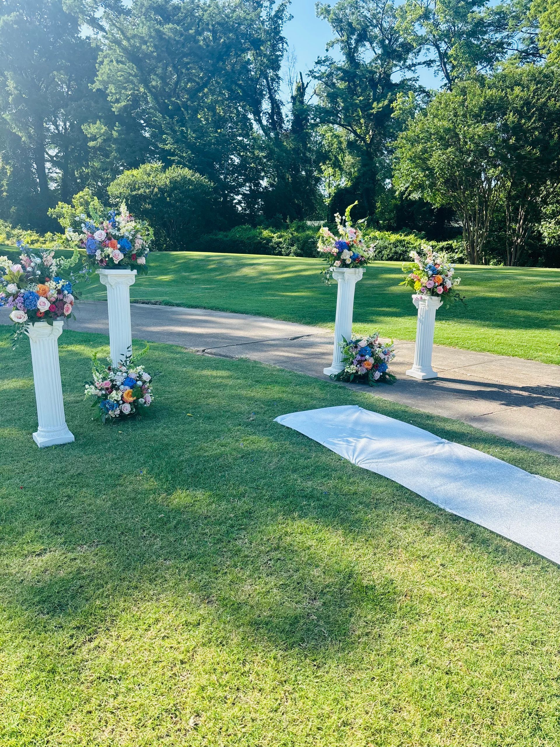 colorful wedding flowers on columns