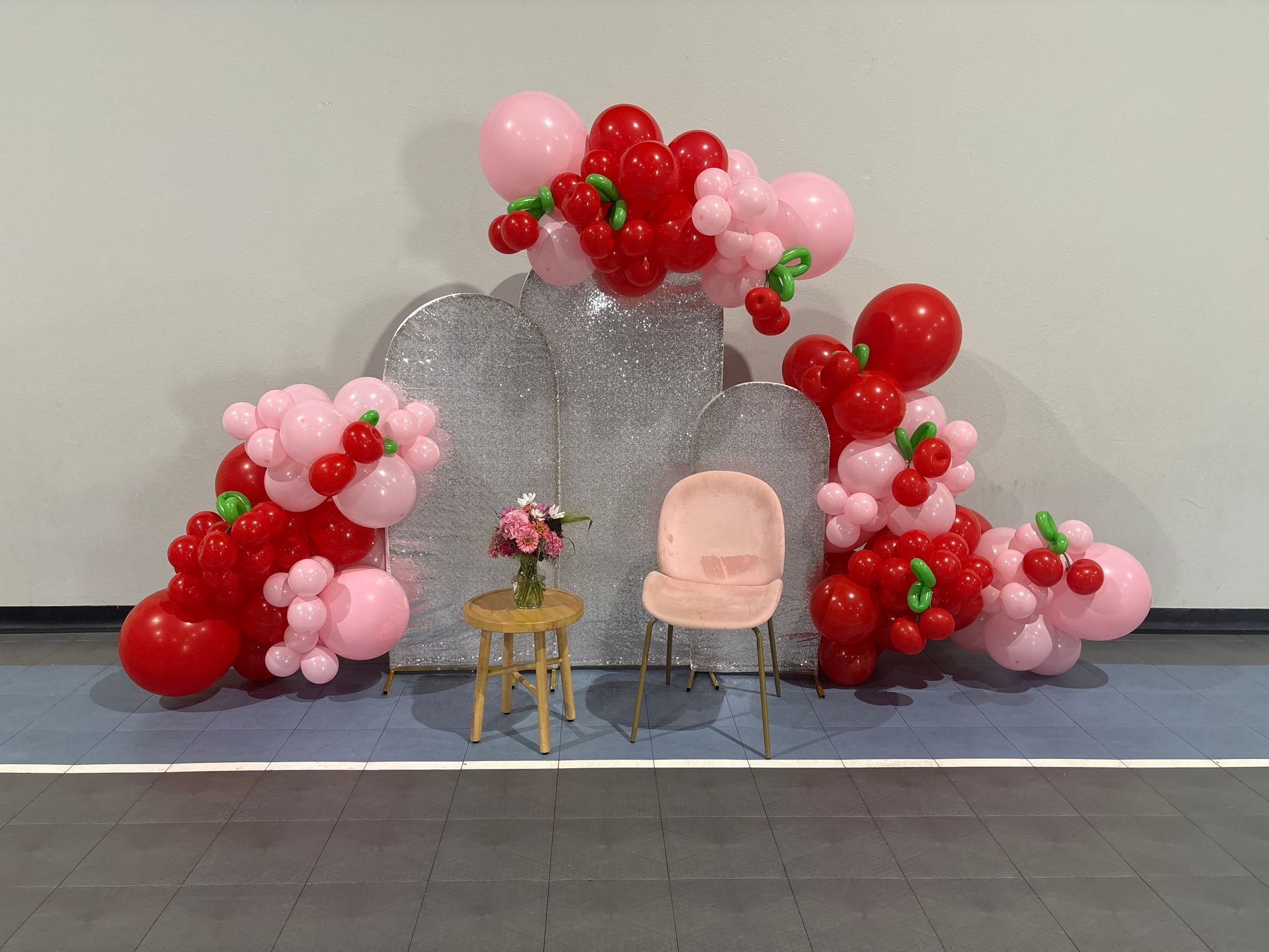 pink and red baby shower balloon backdrop