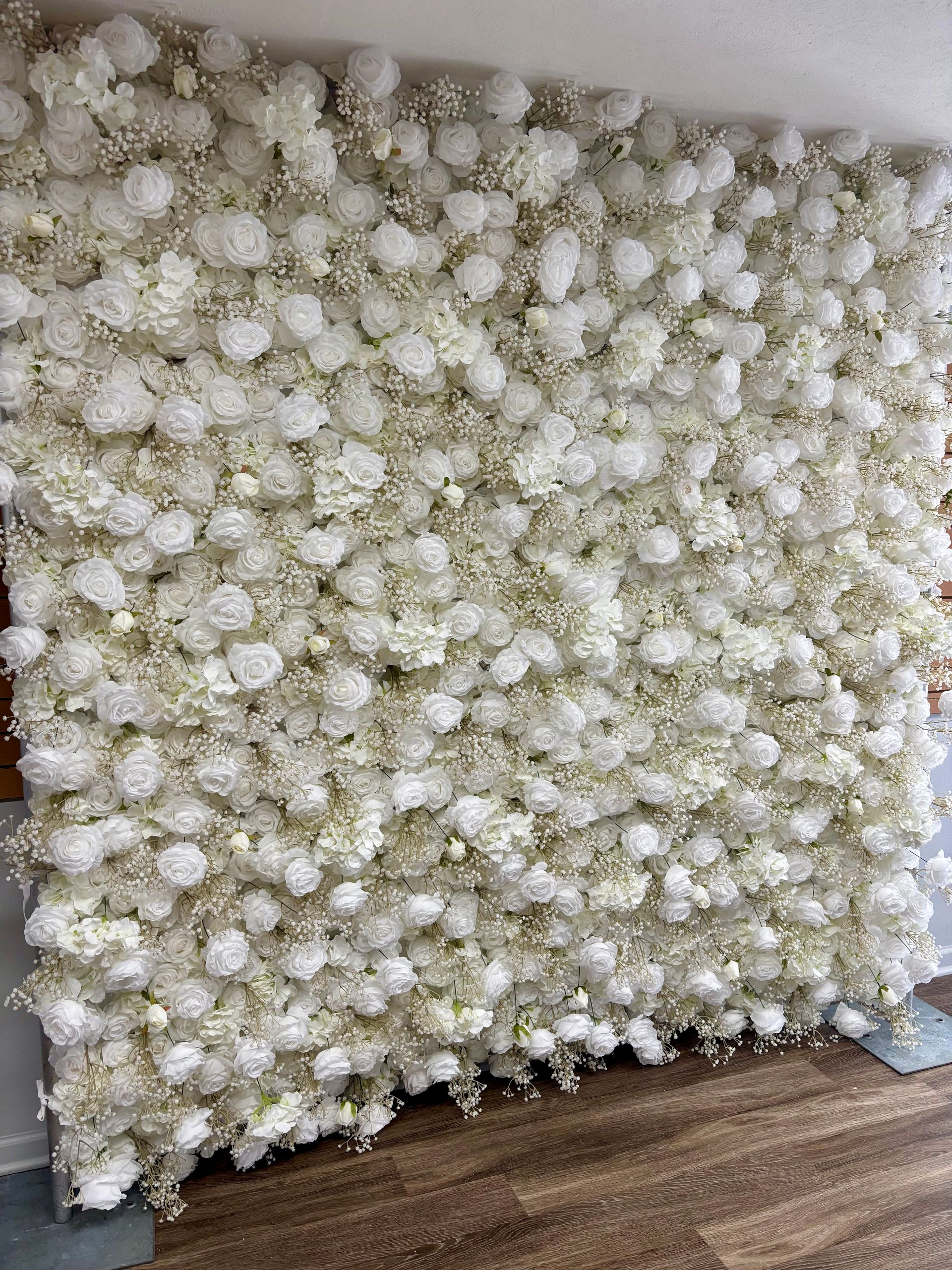 white floral photo backdrop wall