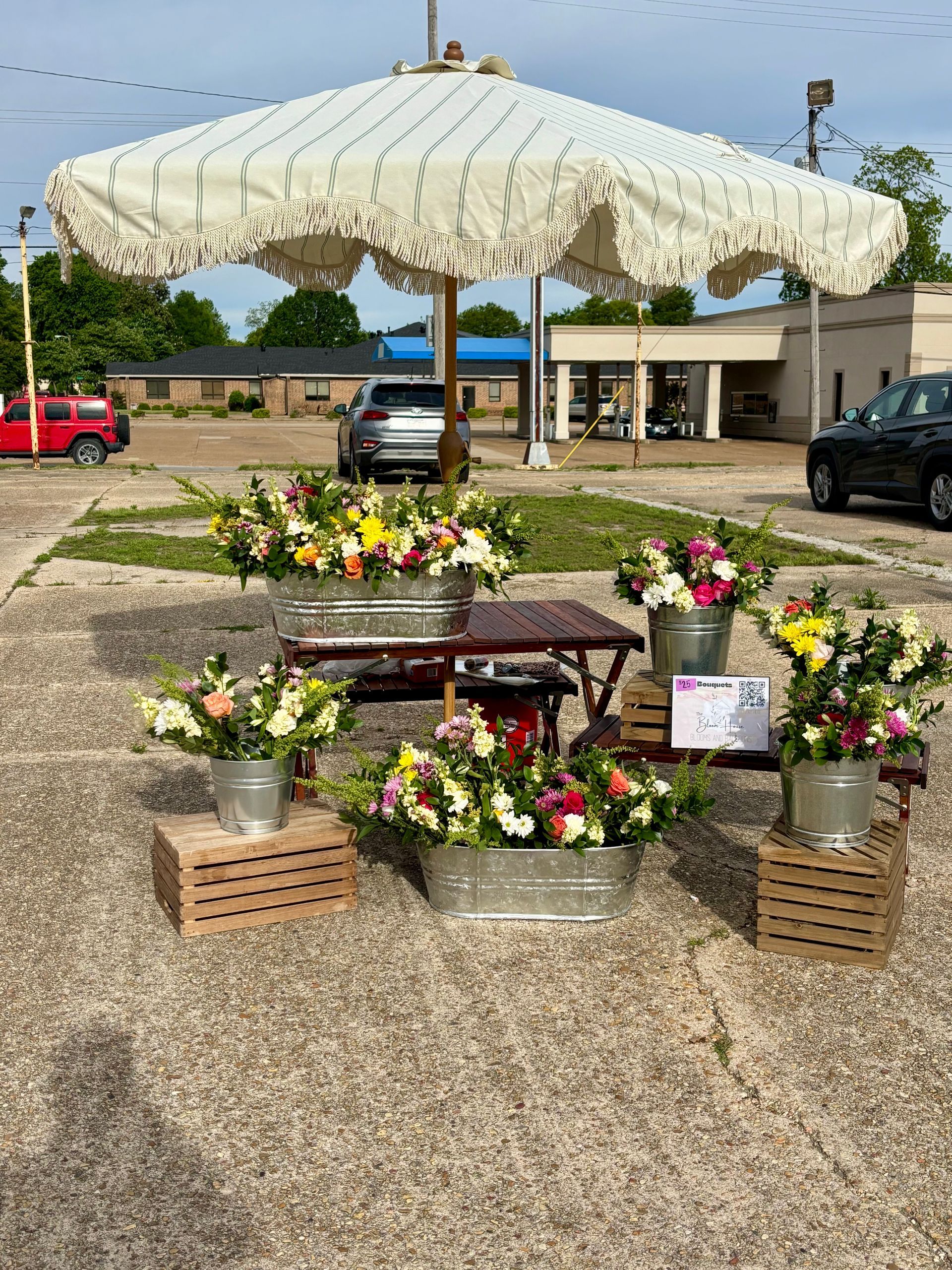 outdoor flowers in tin buckets