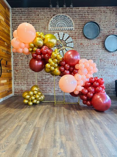 peach, red, and gold, balloon arch