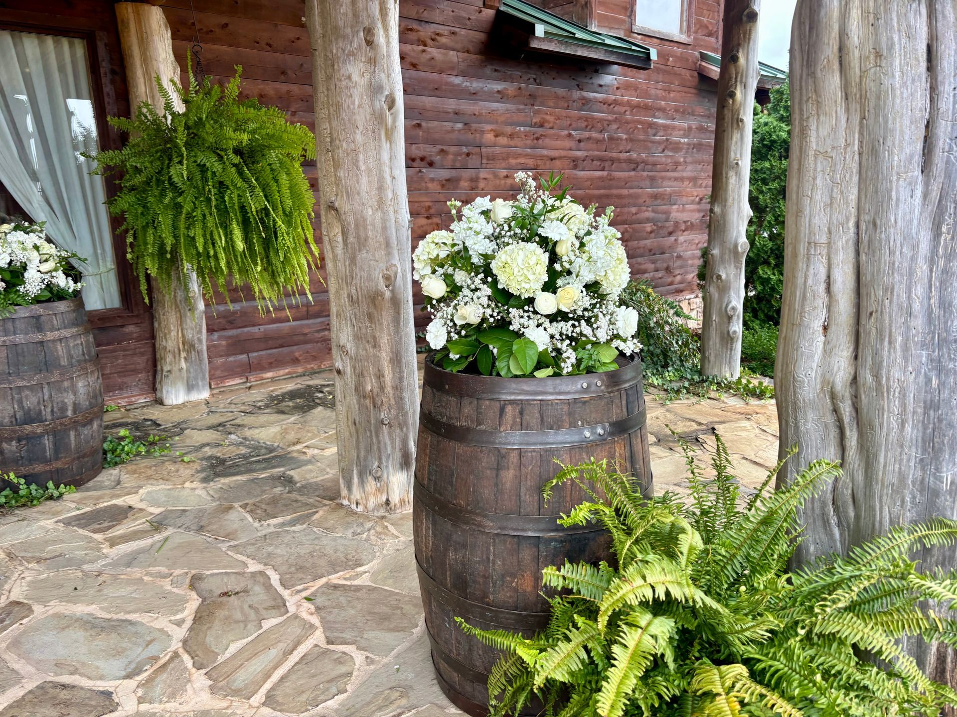 wedding flowers on whiskey barrel