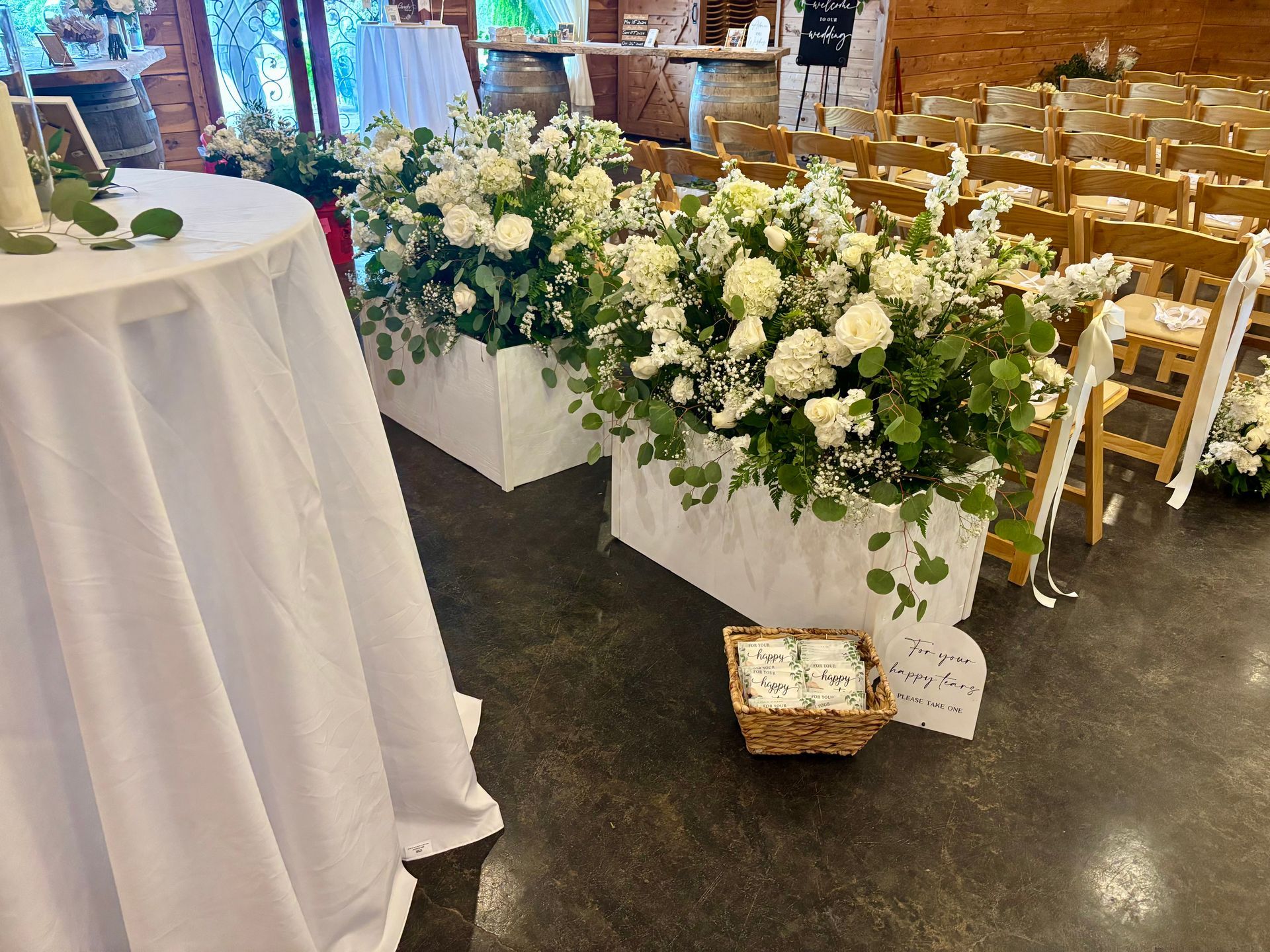 large white floral and greenery arrangements for wedding