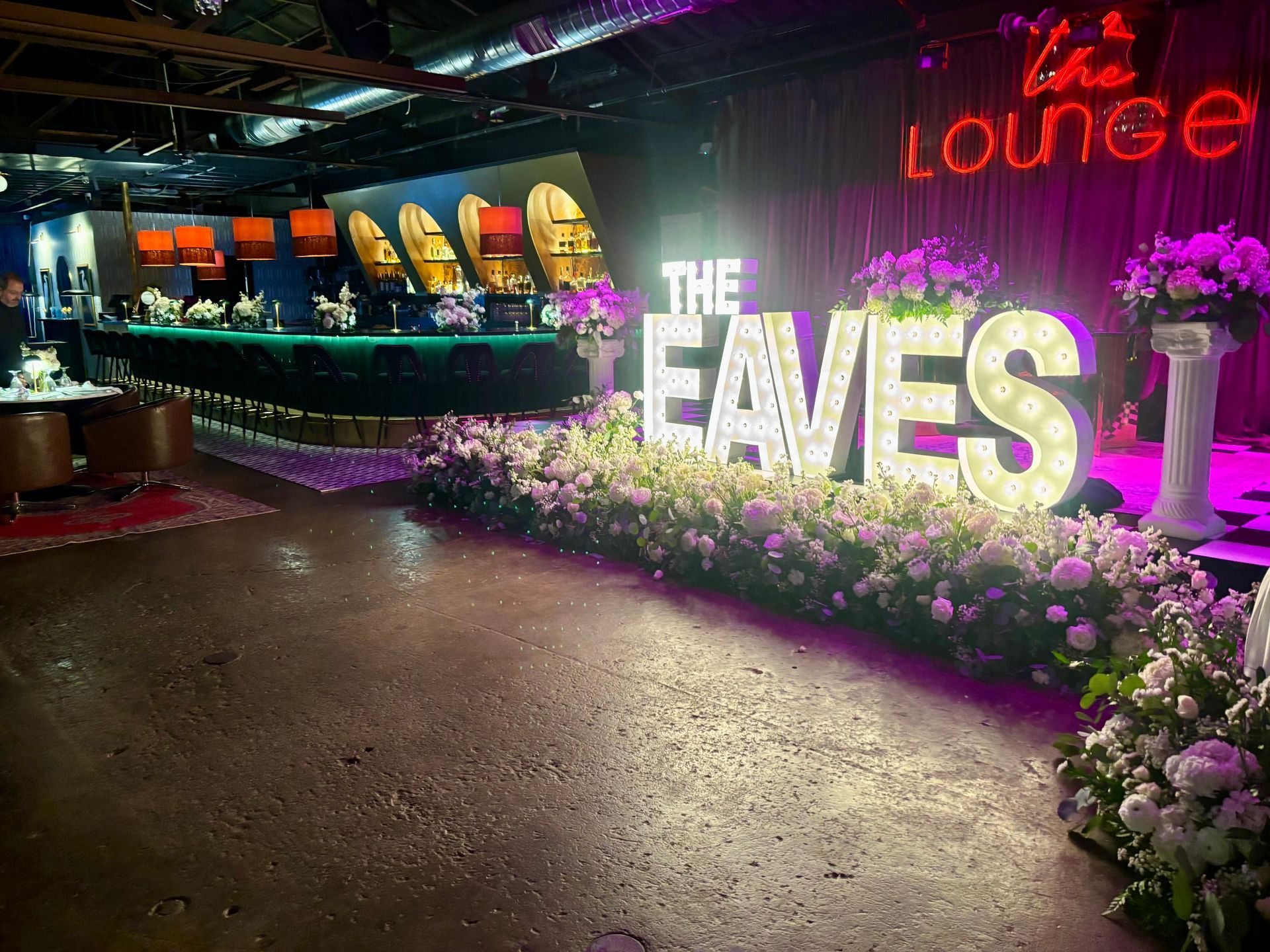 wedding marquee letters surrounded by flowers
