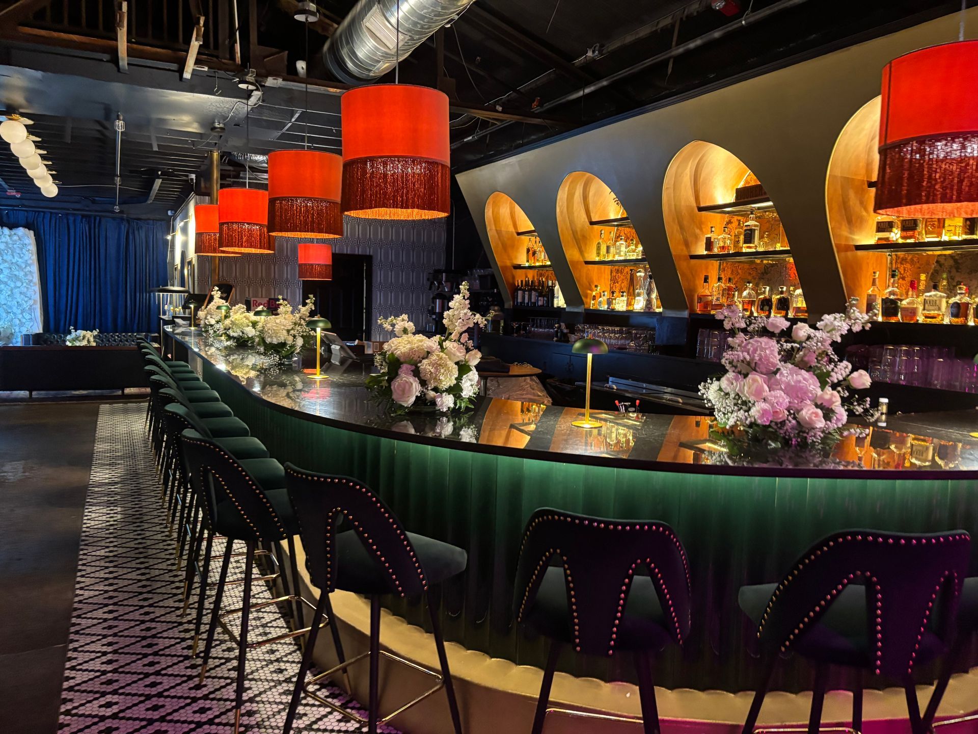 flower arrangements on wedding reception bar