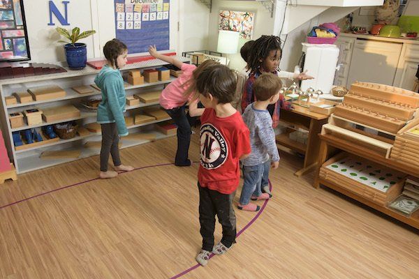 Children during circle time in a Montessori classroom