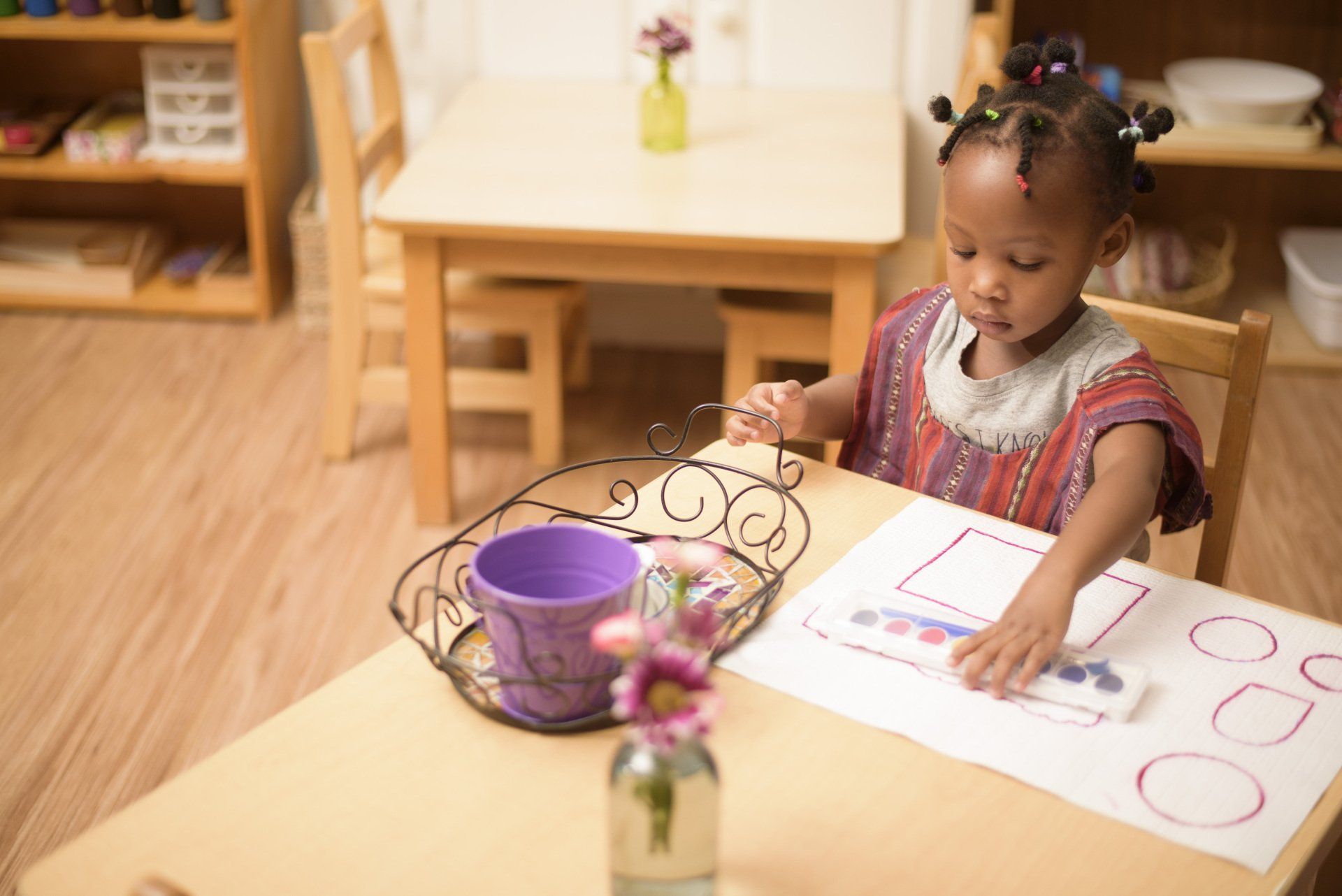 Child working with Montessori materials