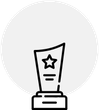 A black and white icon of a trophy with a star on it.