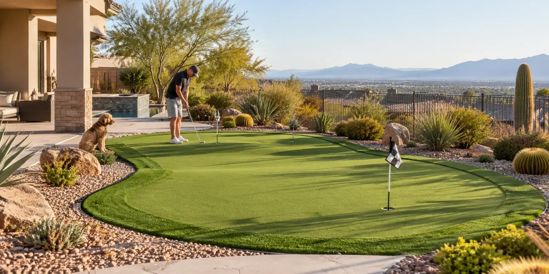 Backyard putting green with desert landscaping and mountain views in Henderson.