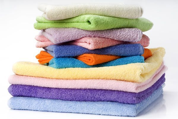 A pile of colorful towels stacked on top of each other