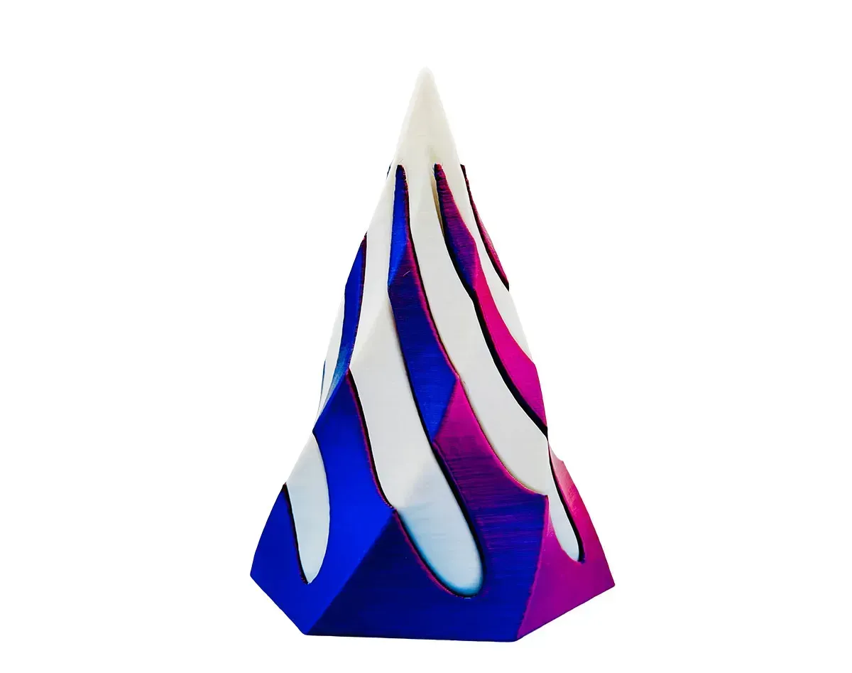 Abstract blue, white, and magenta flame-like geometric sculpture on a white background