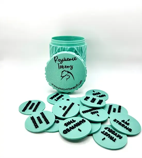 Mint green reusable jar with matching coasters or tokens spread in front, on a white background