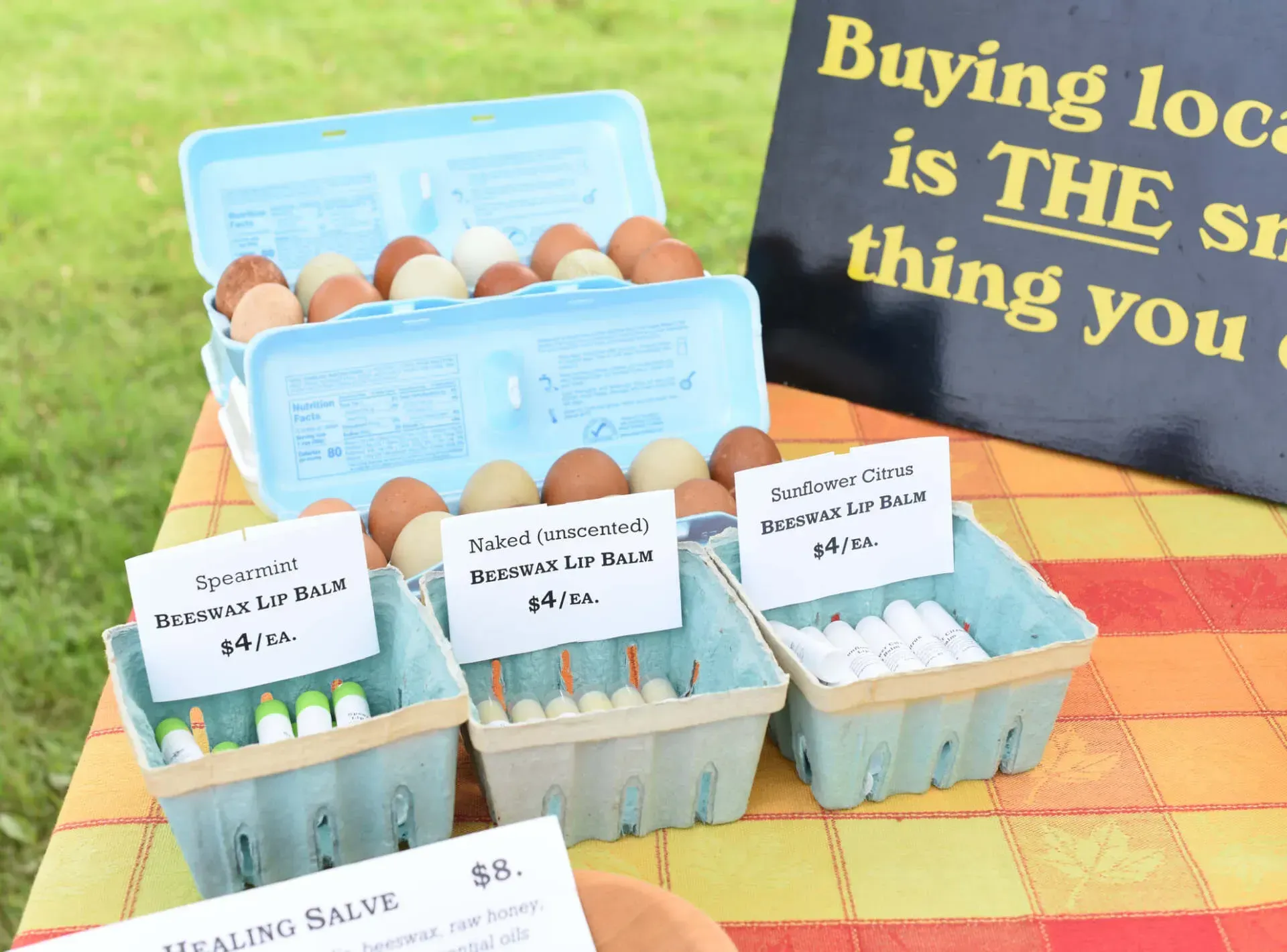 A sign that says buying local is the best thing you can do