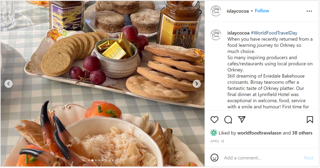 A tray of food and a bowl of food on a table.