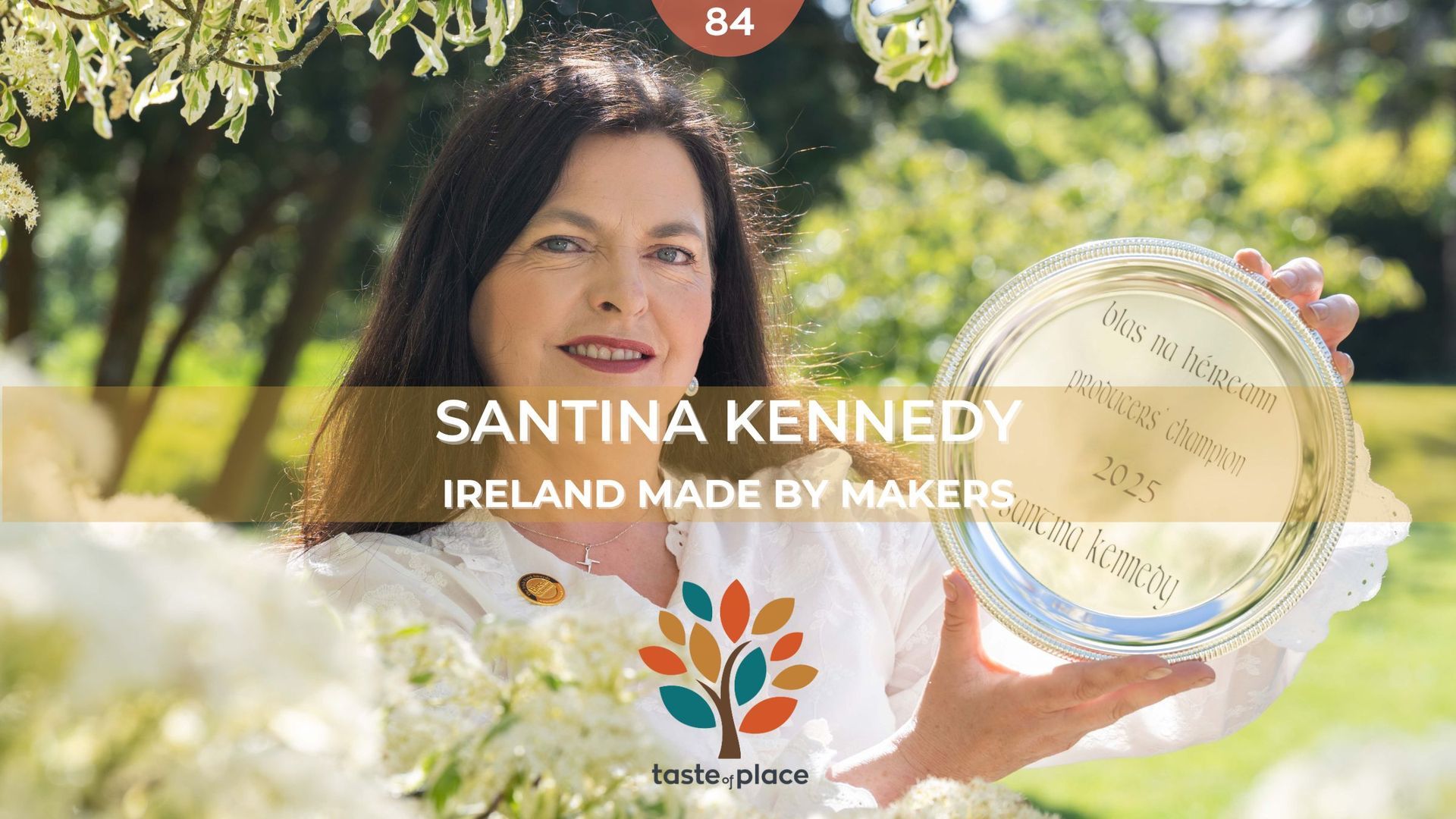 Santina Kennedy holding a silver plate, Ireland Made by Makers, outdoors.