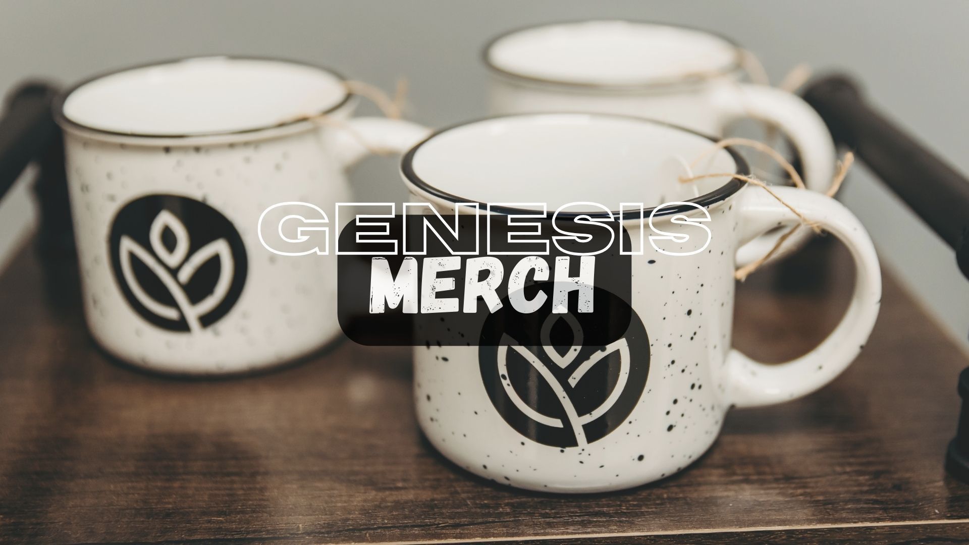 Three white speckled mugs with black logos on a wooden tray, text overlay: 