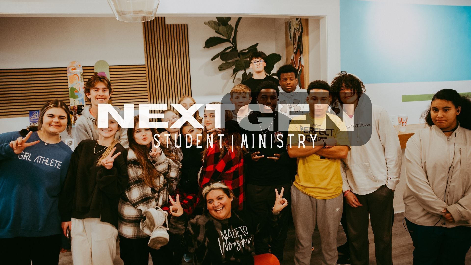 Group of students in a ministry setting, smiling and posing for photo. Text reads: 