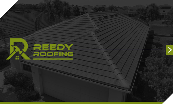 Reedy Roofing logo on a house roof with green and black accents.