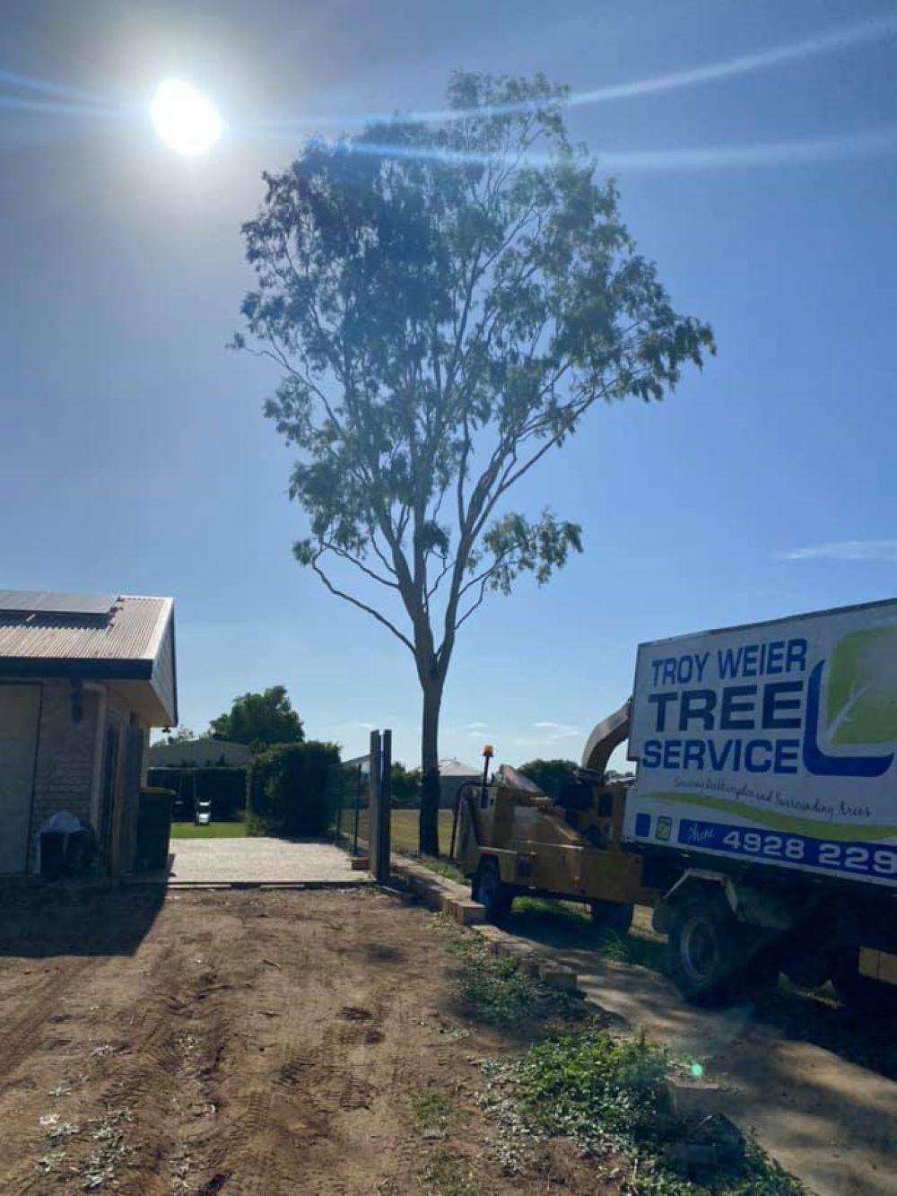 A Tree Service Truck Is Parked in Front of A Tree — Troy Weier Tree Service In Frenchville, QLD