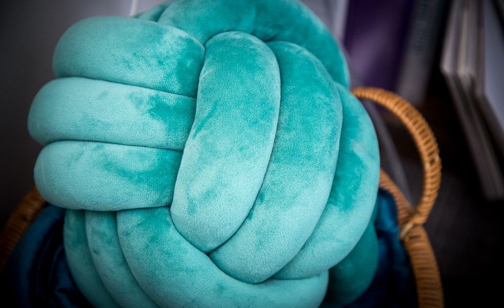 A woven pillow sits in Susan Kelley's office in Fishers, Indiana