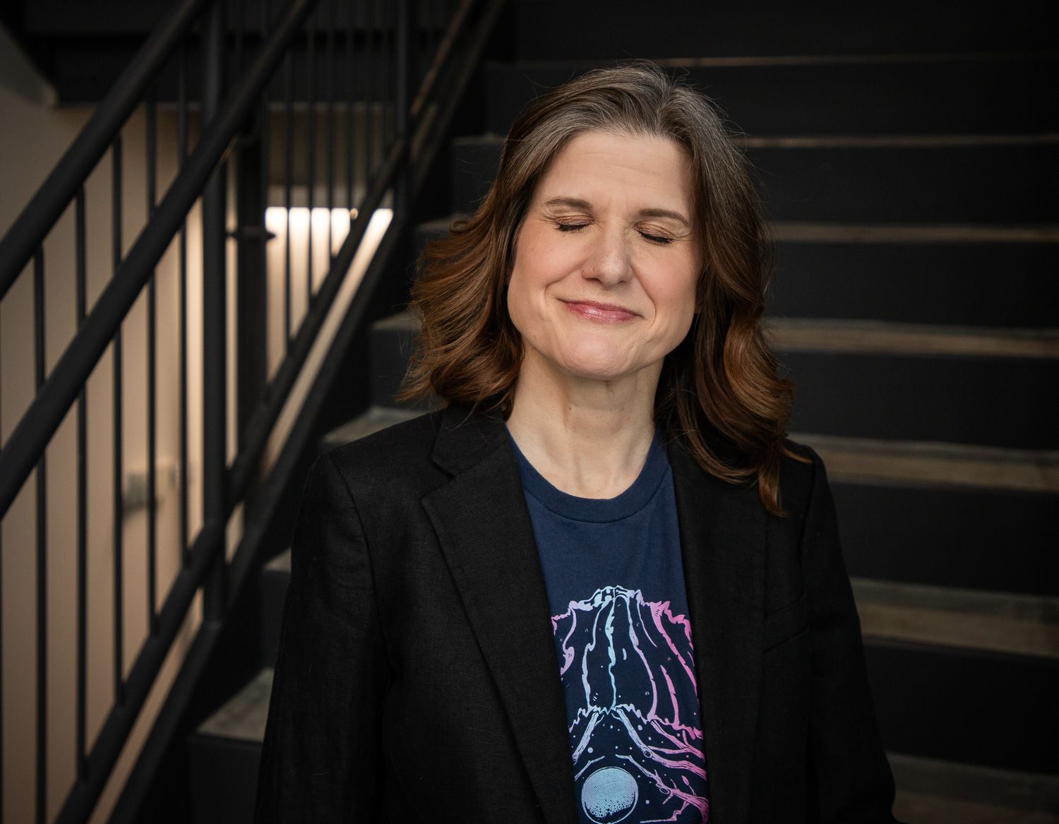 Susan Kelley, smiles with her eyes closed, is a counselor in Fishers, Indiana, offering individual counseling.