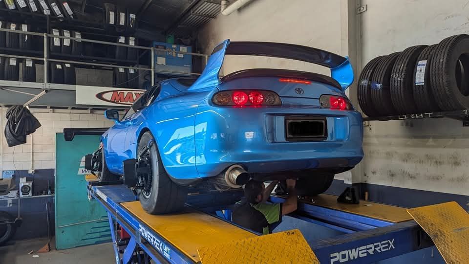Blue Car Lifted Custom Wheel Alignment — High Grade Tyre and Mechanical in Toowoomba City, QLD