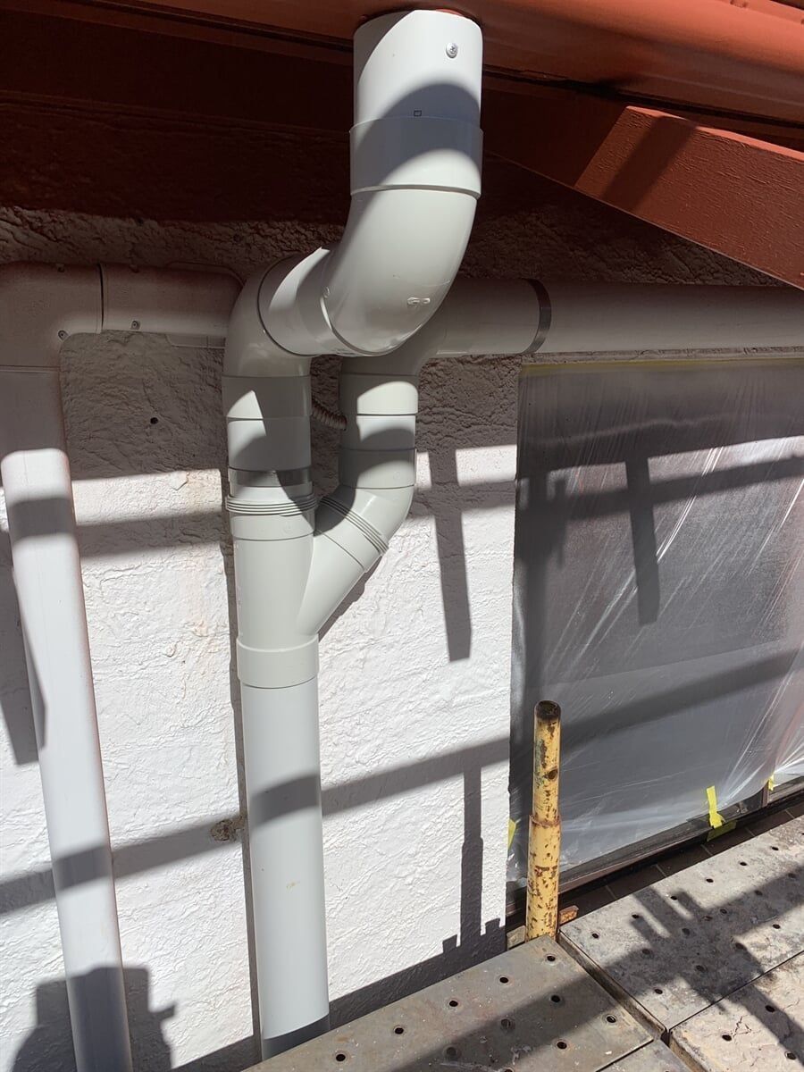 A Close Up Of A White Pipe On The Side Of A Building — Richardson Plumbing & Gas Service In Port Macquarie, NSW