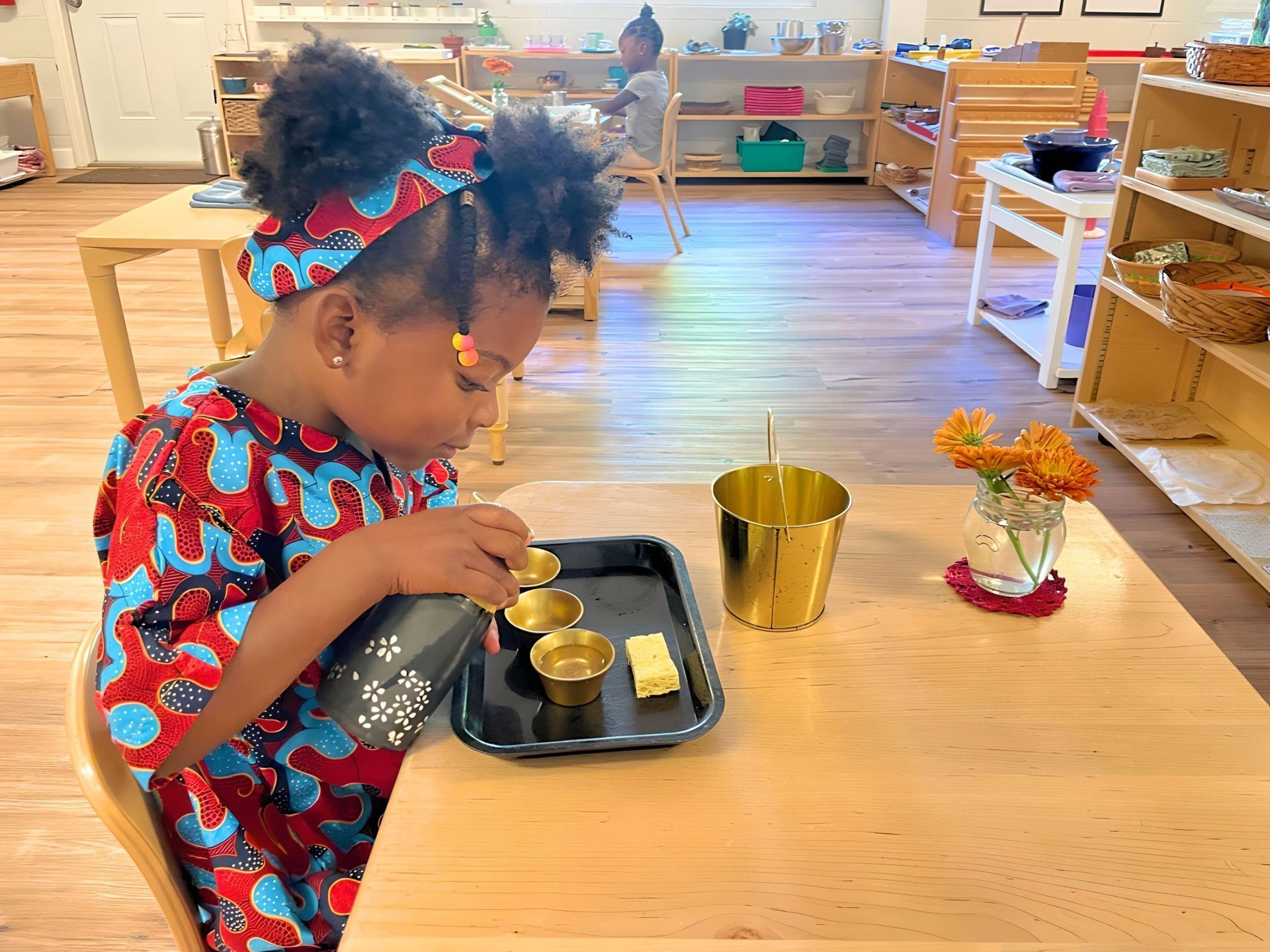 Montessori child working on practical life skills