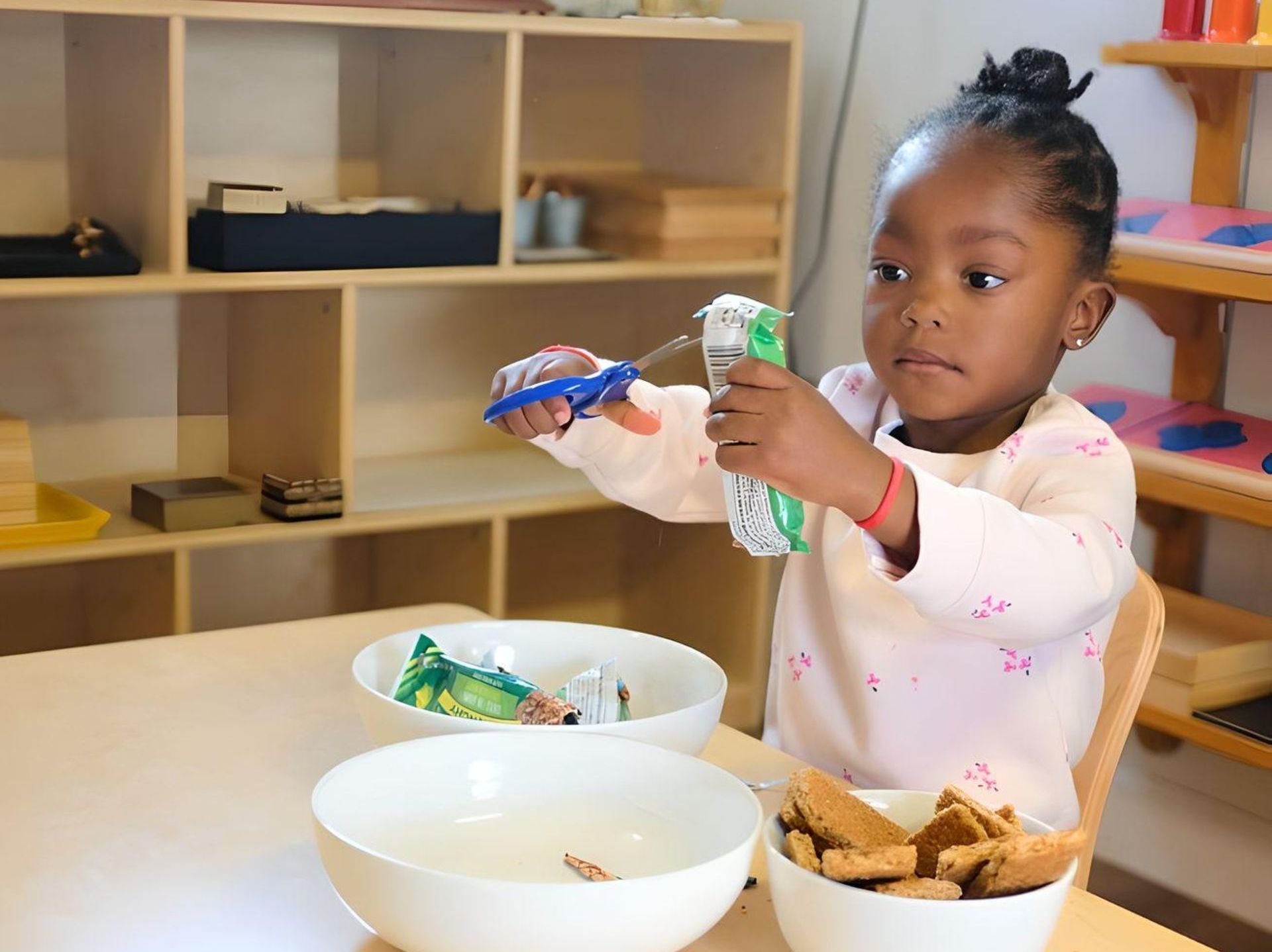 Montessori child working on practical life skills