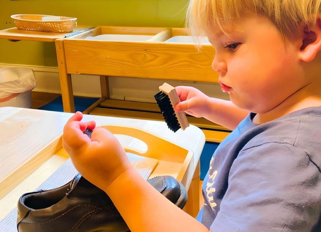 Montessori child working on practical life skills