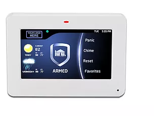 A white thermostat with a screen that says armed on it
