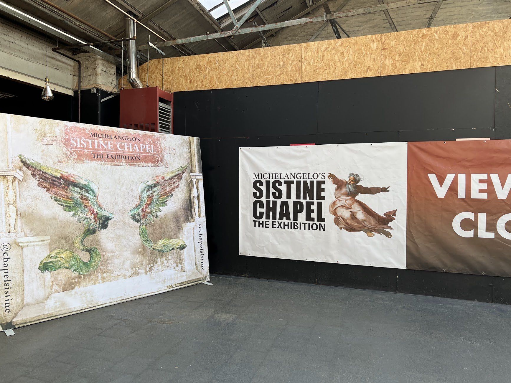 Banners for the Sistine Chapel exhibition, showing a chapel illustration, and a view of the event.