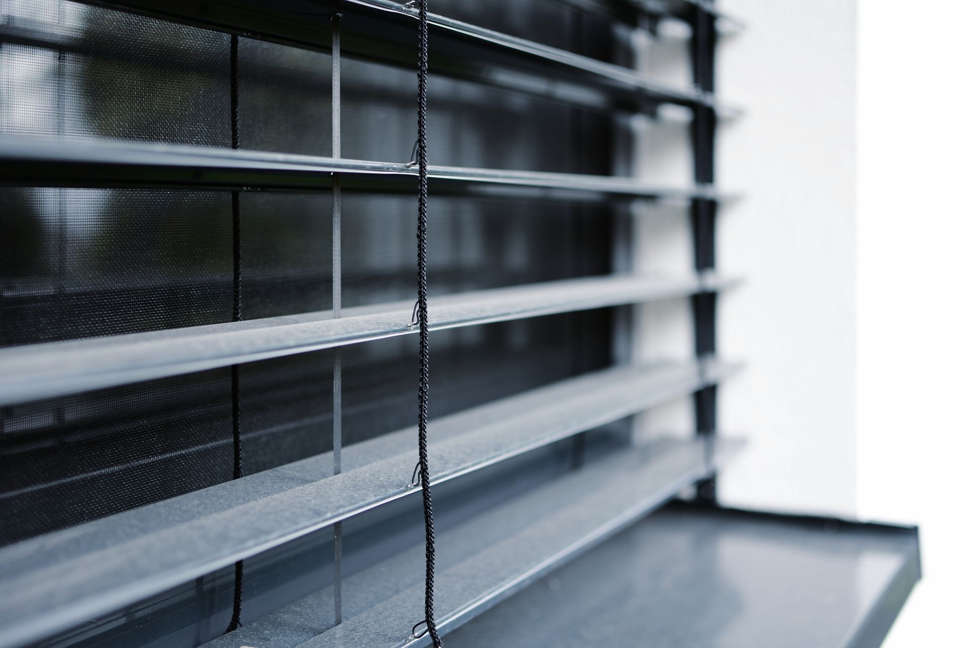 closeup window external aluminum venetian blinds
