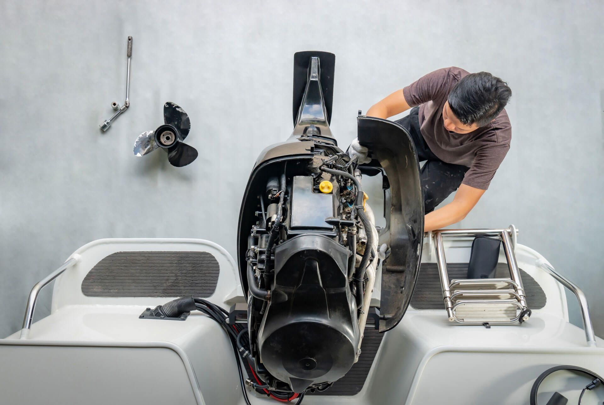man fixing marine electricity