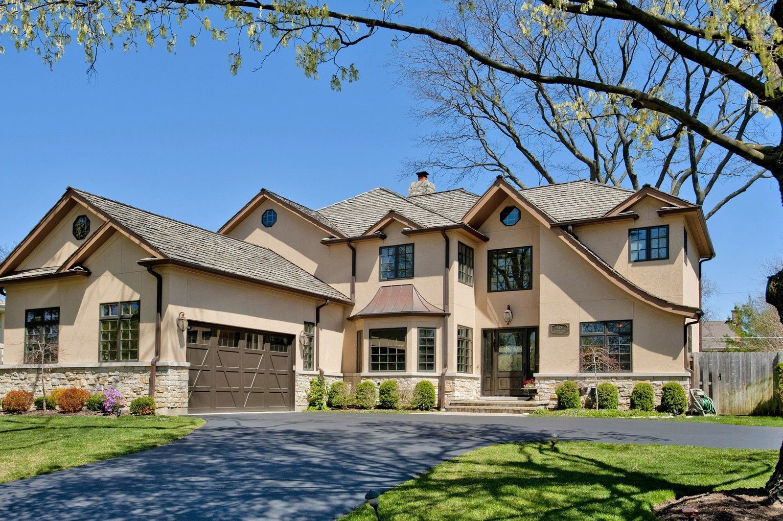 A large house with a driveway leading to it
