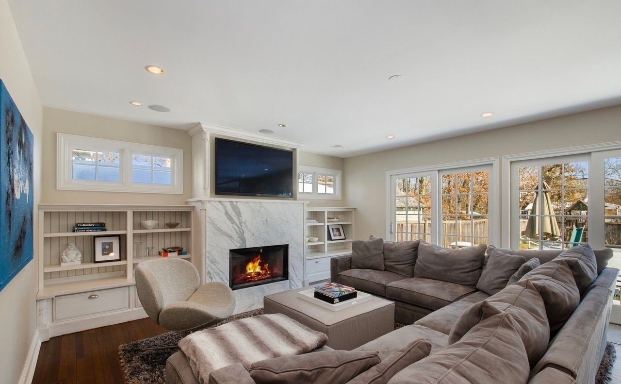 A living room filled with furniture and a fireplace.