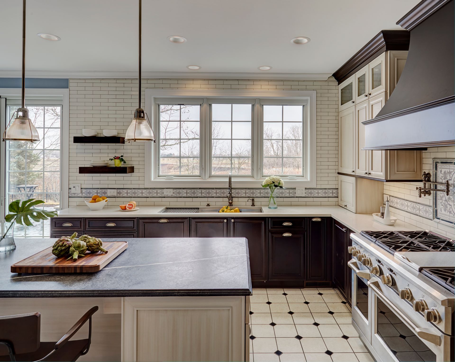 A kitchen with a large island and a stove