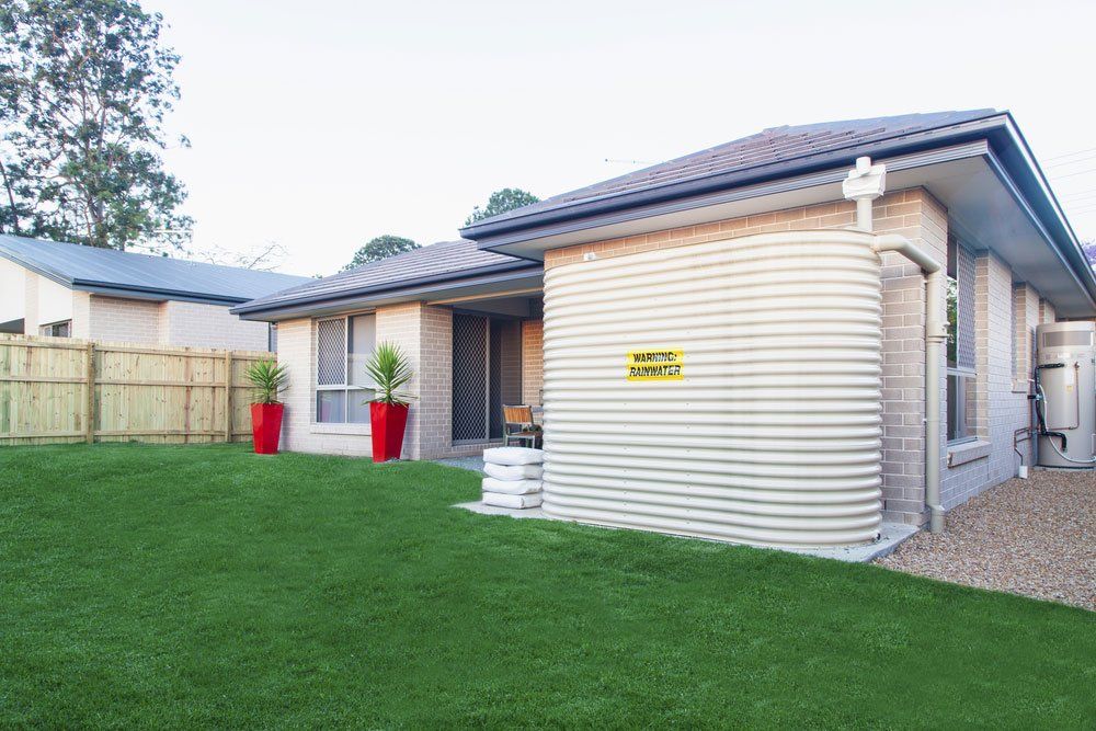 Residential Rainwater Tank in Backyard — Greg Mitchell Plumbing In Murgon, QLD