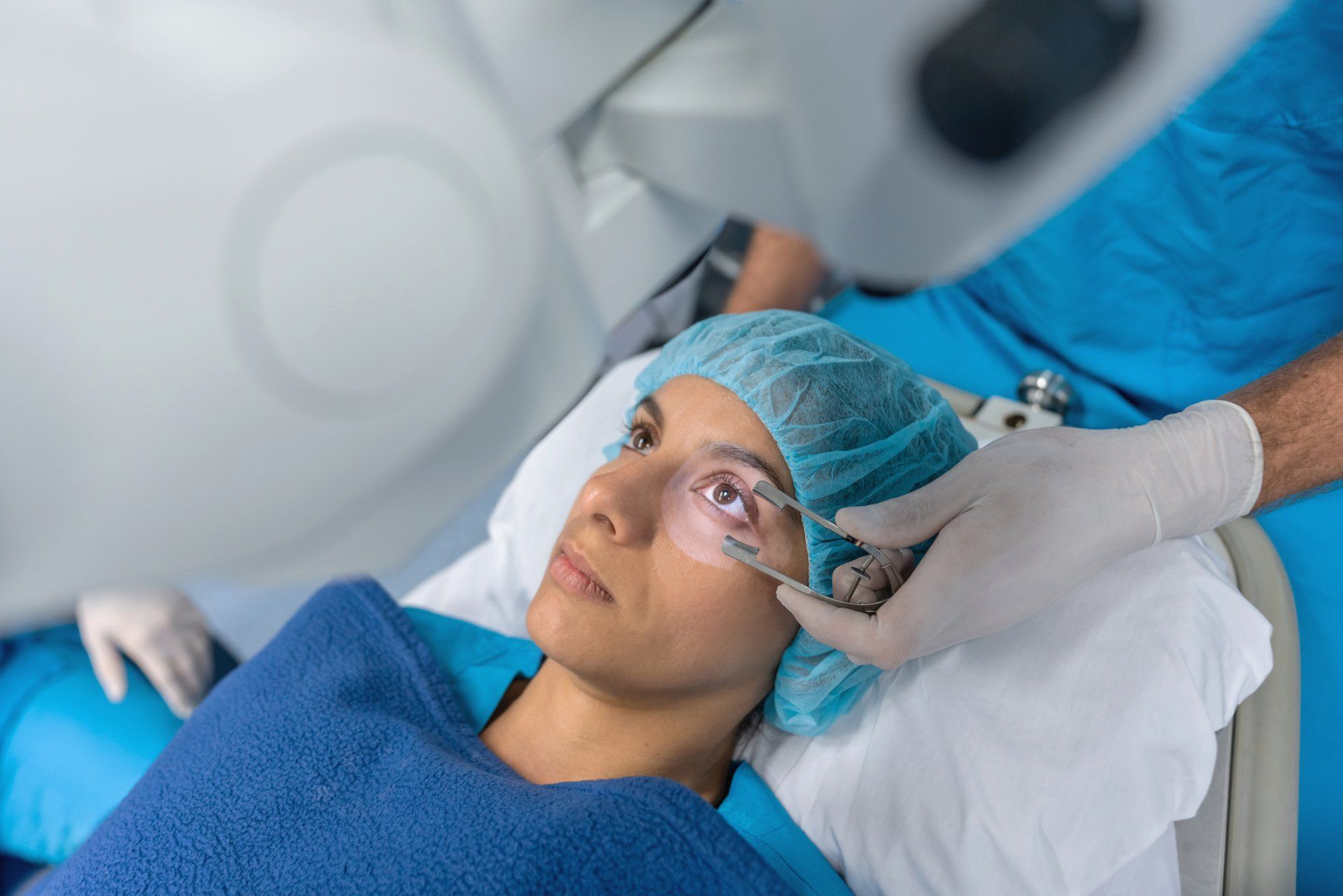 Doctor checking on patient lying down — Laurinburg, NC — Laser Eye Institute PA