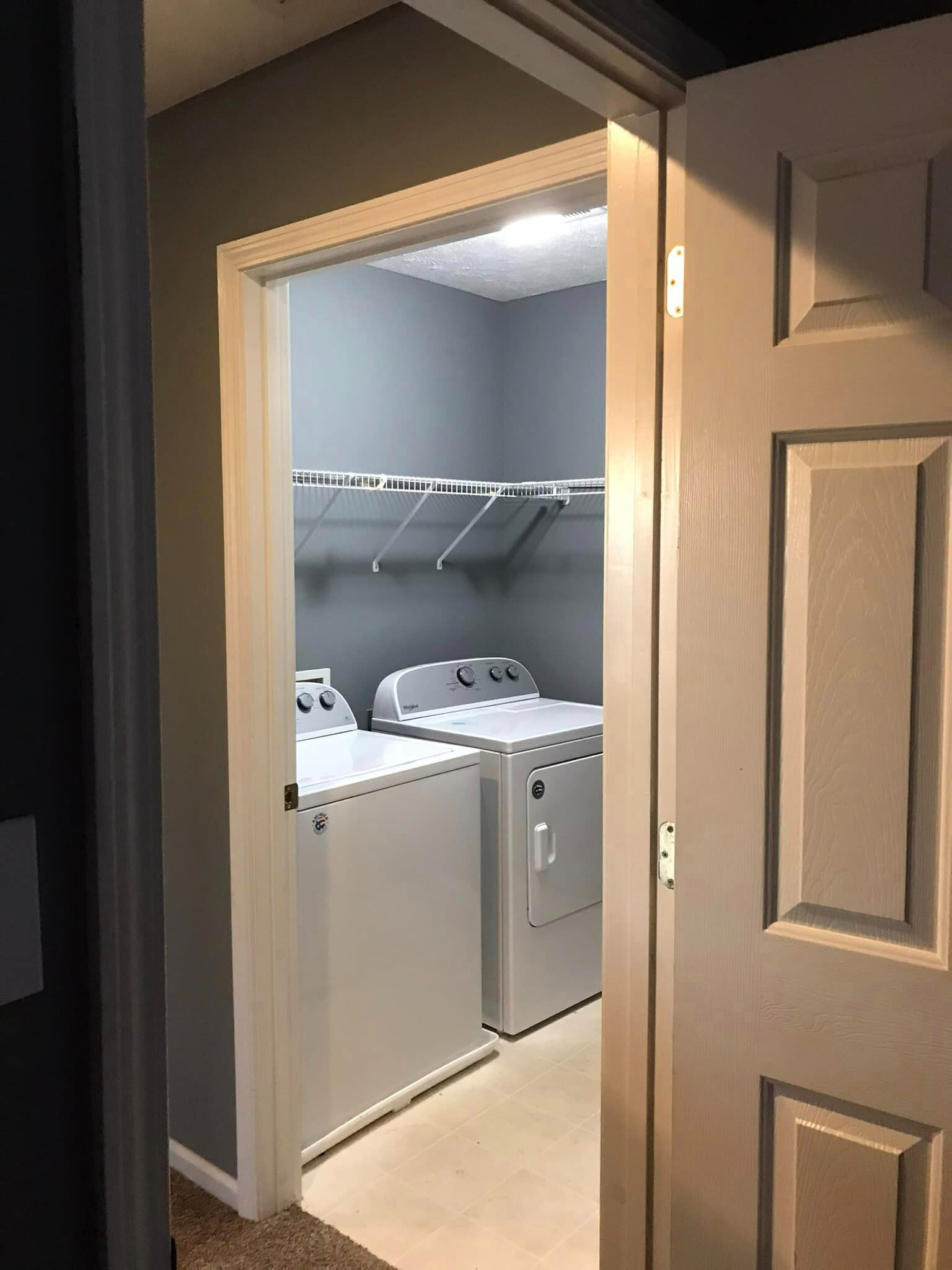A laundry room with a washer and dryer in it.