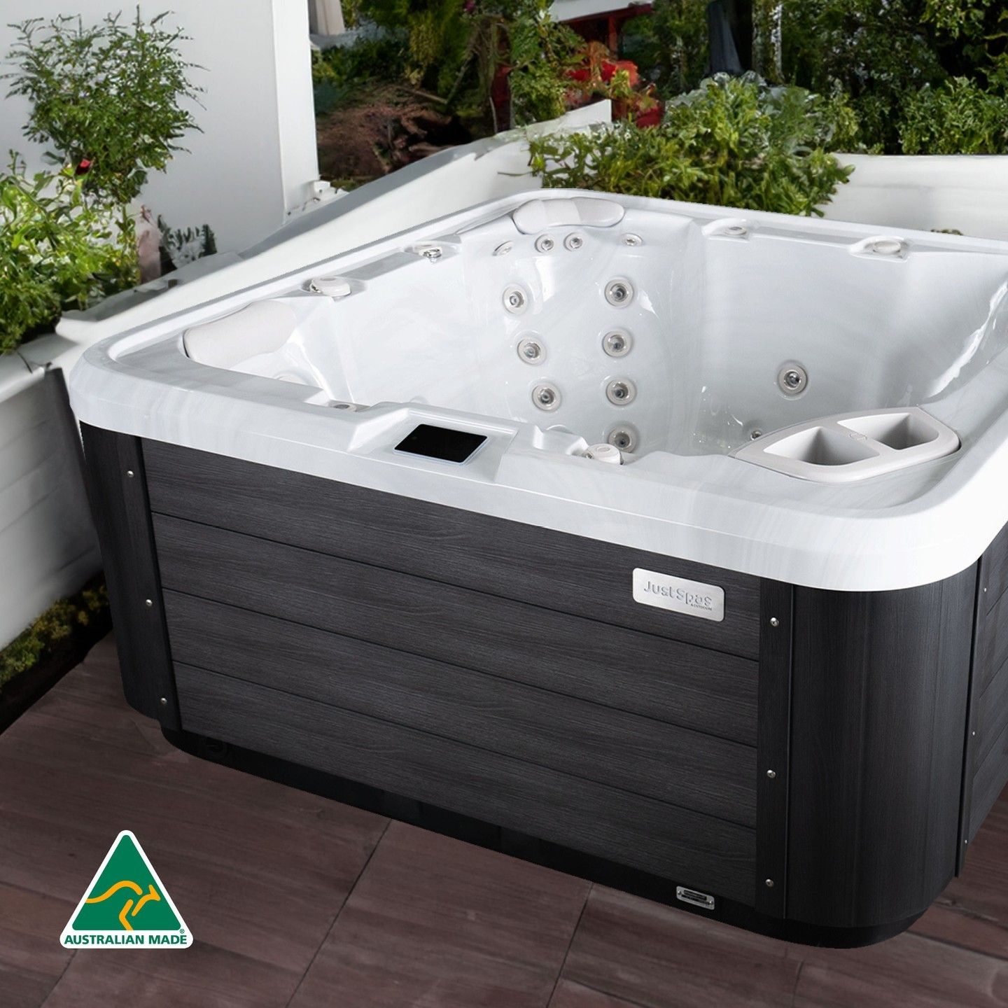 Outdoor Hot Tub on a Patio With White Interior — Just Spas Forster in Forster, NSW