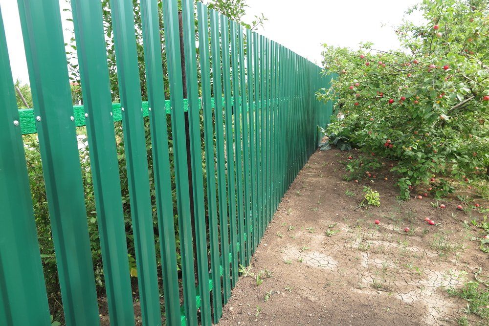 Green metal picket fence — Aluminium Fencing in Burleigh Heads, QLD
