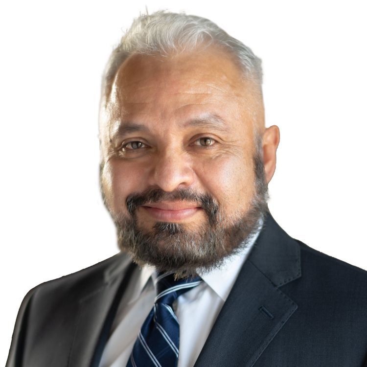 A man with a beard is wearing a suit and tie.