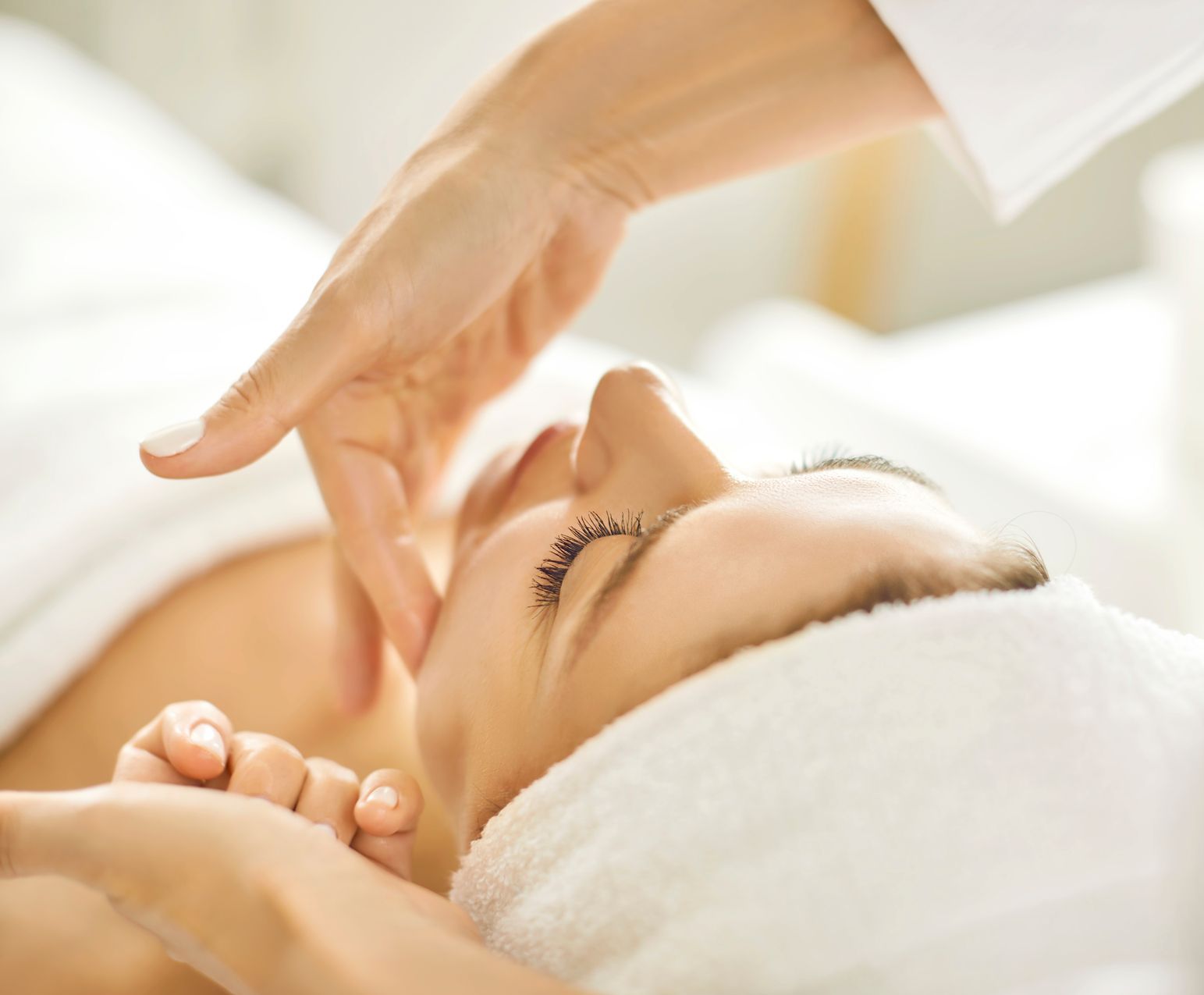 A woman is getting a facial treatment at a spa.