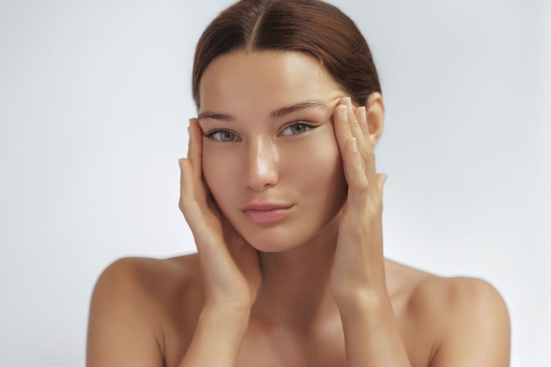 a woman holding her face in her hands