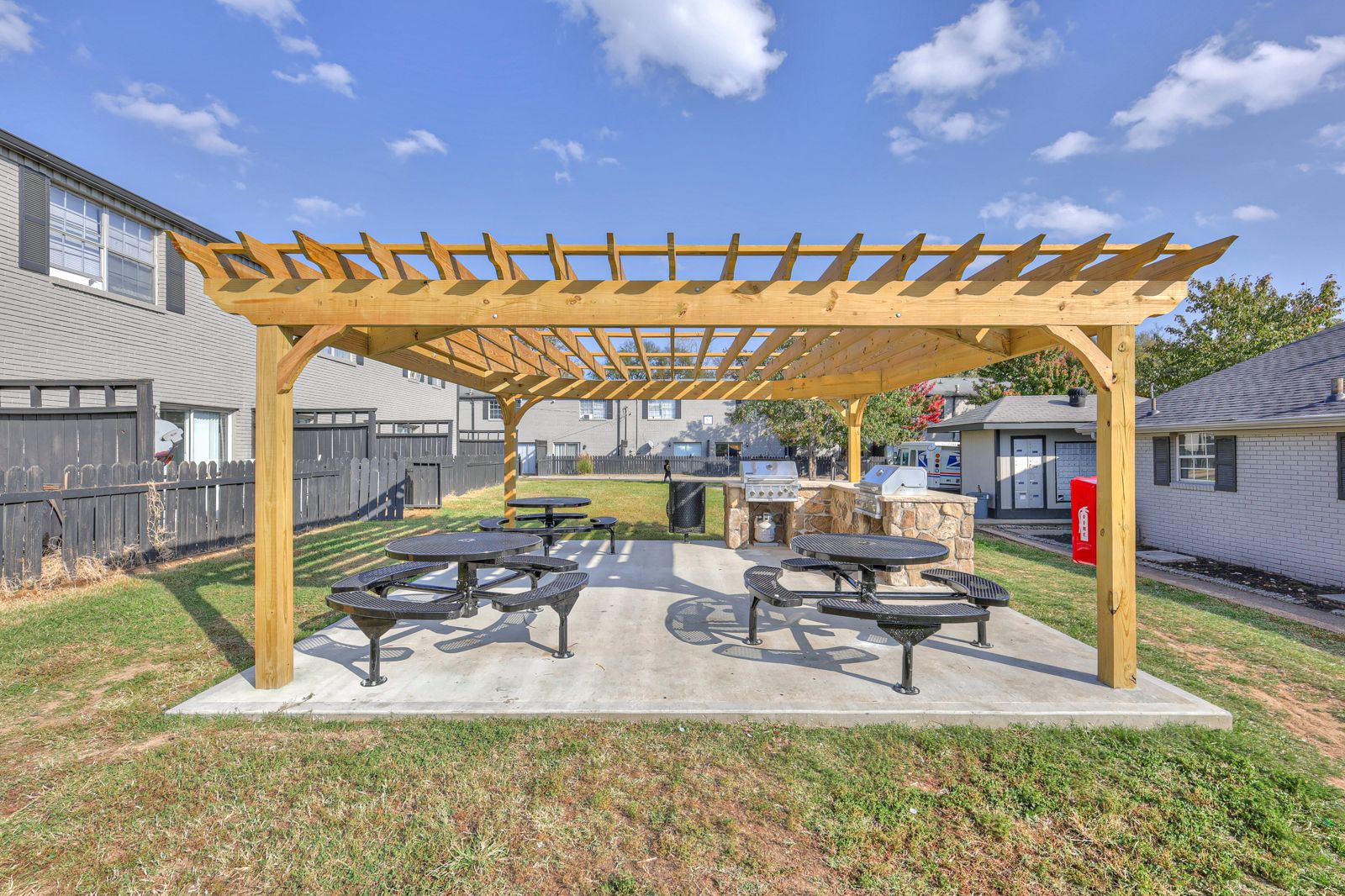 Photo of the community barbecue area, showing various places to sit