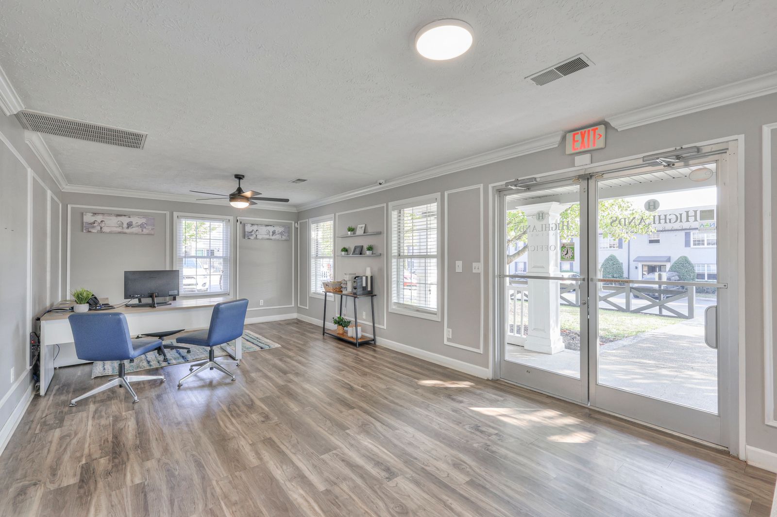 Photo of the community office area, showing the exit and plenty of natural lighting