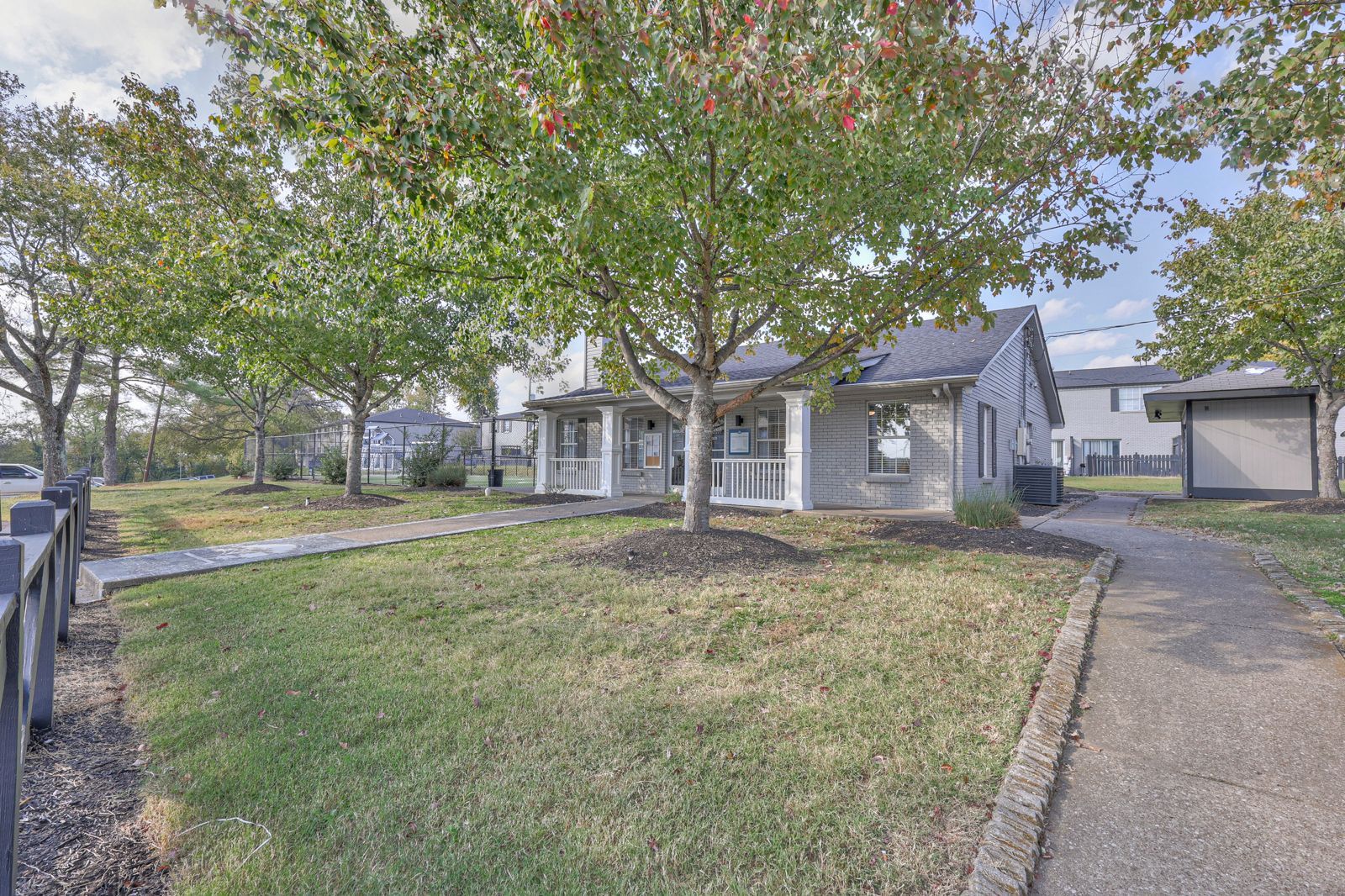 Photo of the community office, seen from the outside, with a walkway leading up