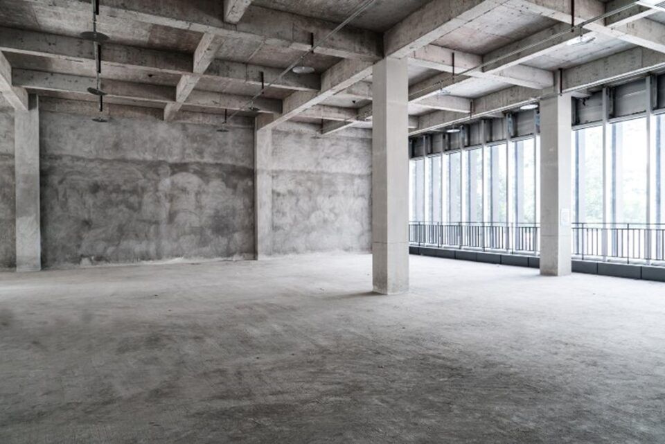 Empty room with concrete walls and windows, located in TX and LA
